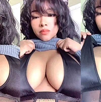 Uniquesora lifts her top to show off her amazing boobs