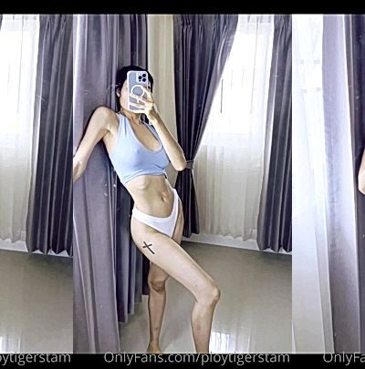 onlyfans model Ploytigerstam fondles huge tits in a mirror selfie