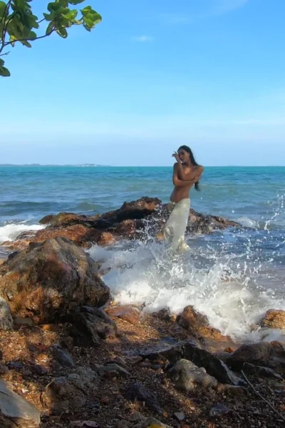 naughty babe Ploytigerstam flashes her small ass in the ocean while shooting