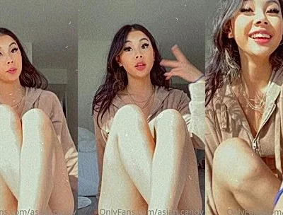 teasing video of onlyfans model Asian.candy takes of her  loth and fondles her big tits