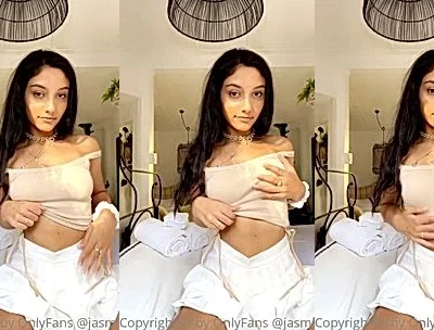 Jasminx stares at the camera as she fondle her juicy boobs