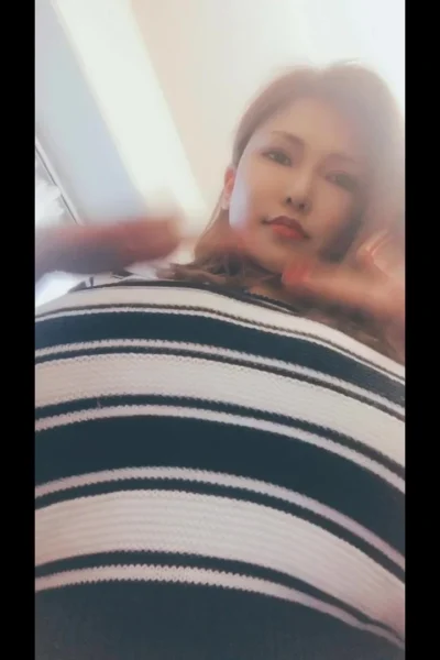 hot Japanese model takesoff her shirt to show off her amazing tits
